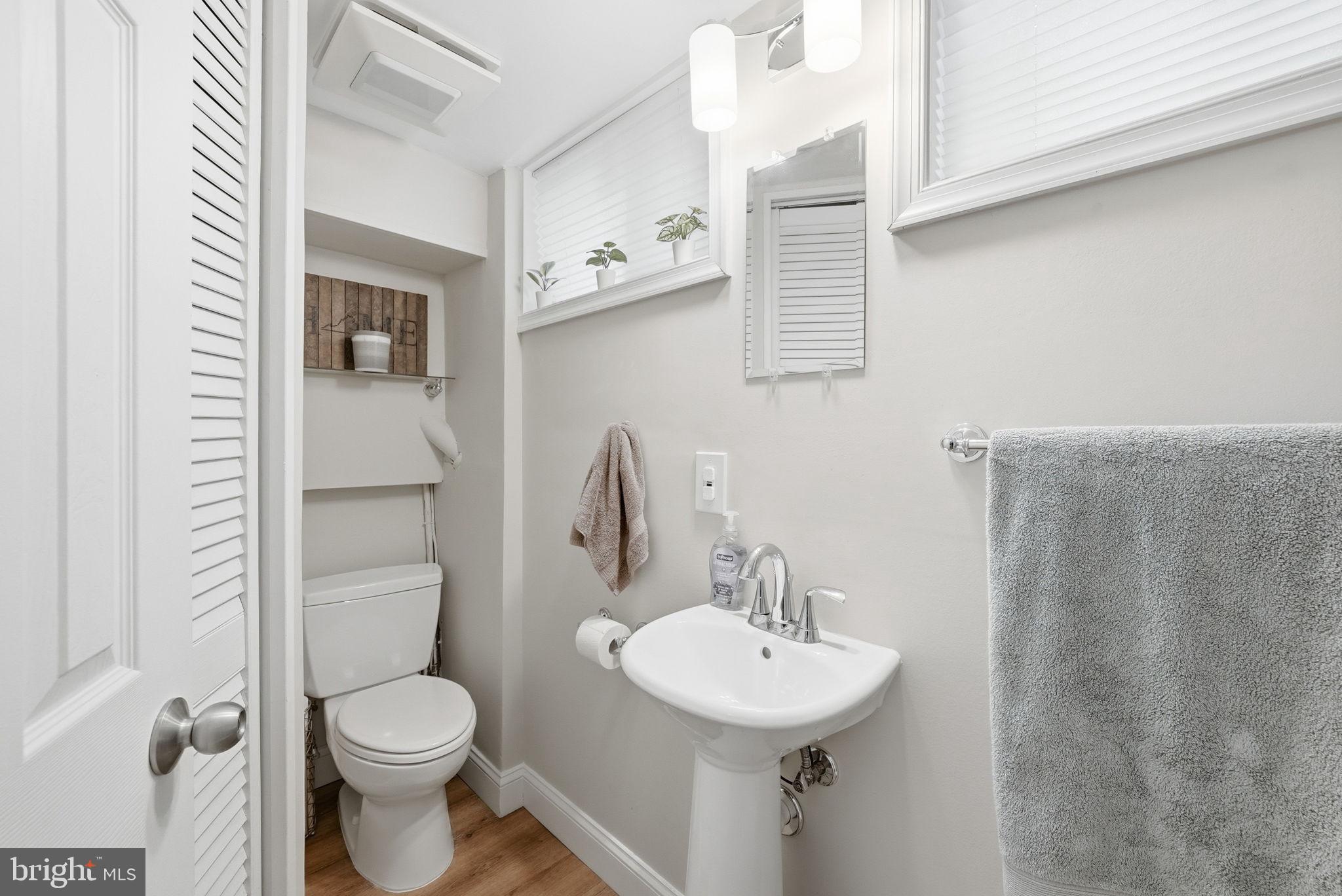 4616 Exeter Street Annandale, VA 22003 - Photo 24 of 36 a bathroom with a toilet sink and mirror