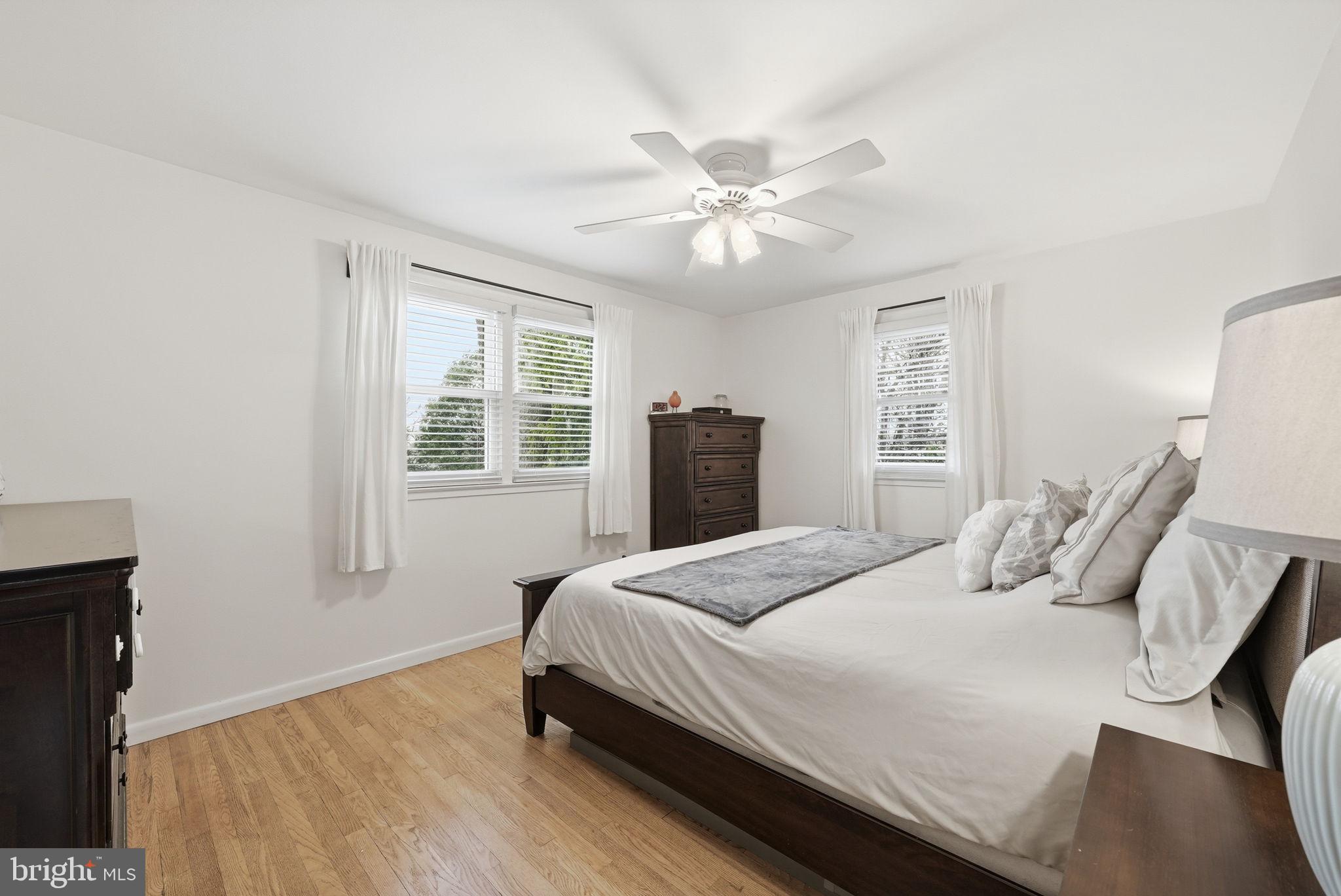 4616 Exeter Street Annandale, VA 22003 - Photo 29 of 36 a bedroom with a large bed and wooden floor