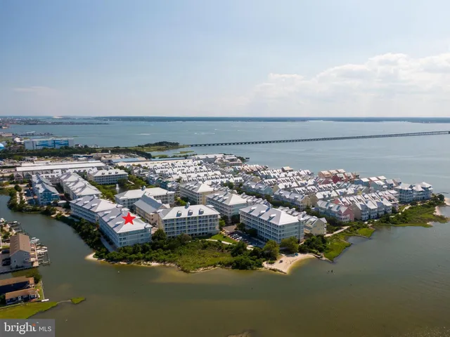 an aerial view of a house with a lake view