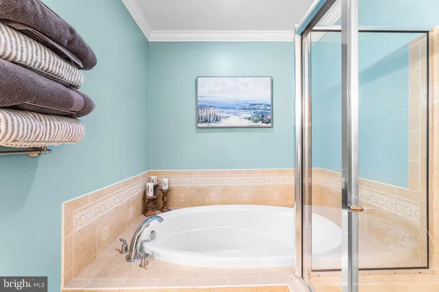 a bathroom with a bathtub and a sink