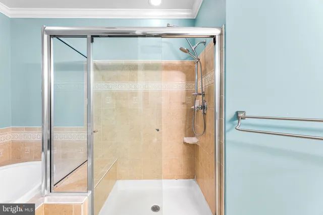 a bathroom with a glass shower door