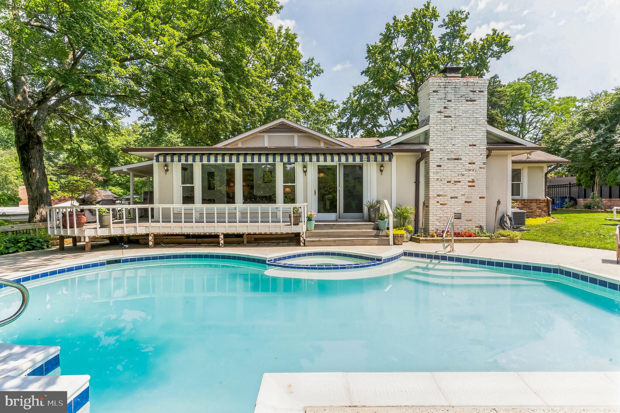 9329 Harvey Road Silver Spring, MD 20910 - Photo 37 of 40 a view of a house with swimming pool and porch with furniture