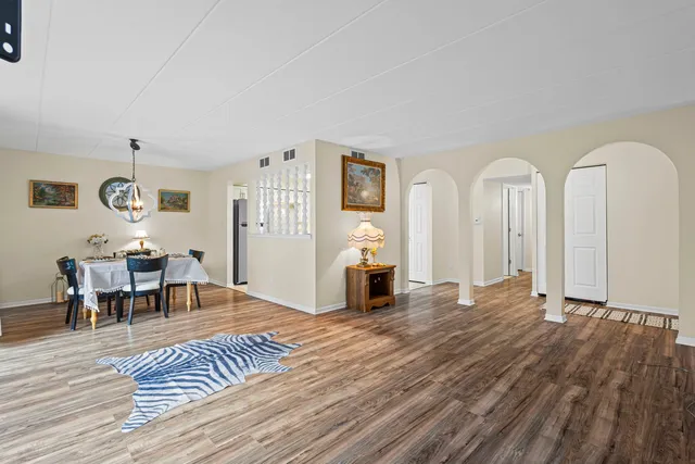 a view of a livingroom with furniture and wooden floor