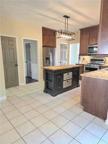 a view of a kitchen with a sink and a window