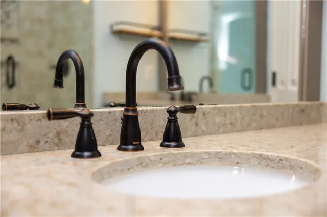 a view of a two chairs in the back yard of the house