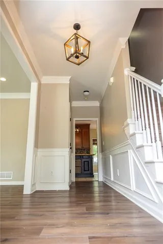 a view of a livingroom with furniture and wooden floor