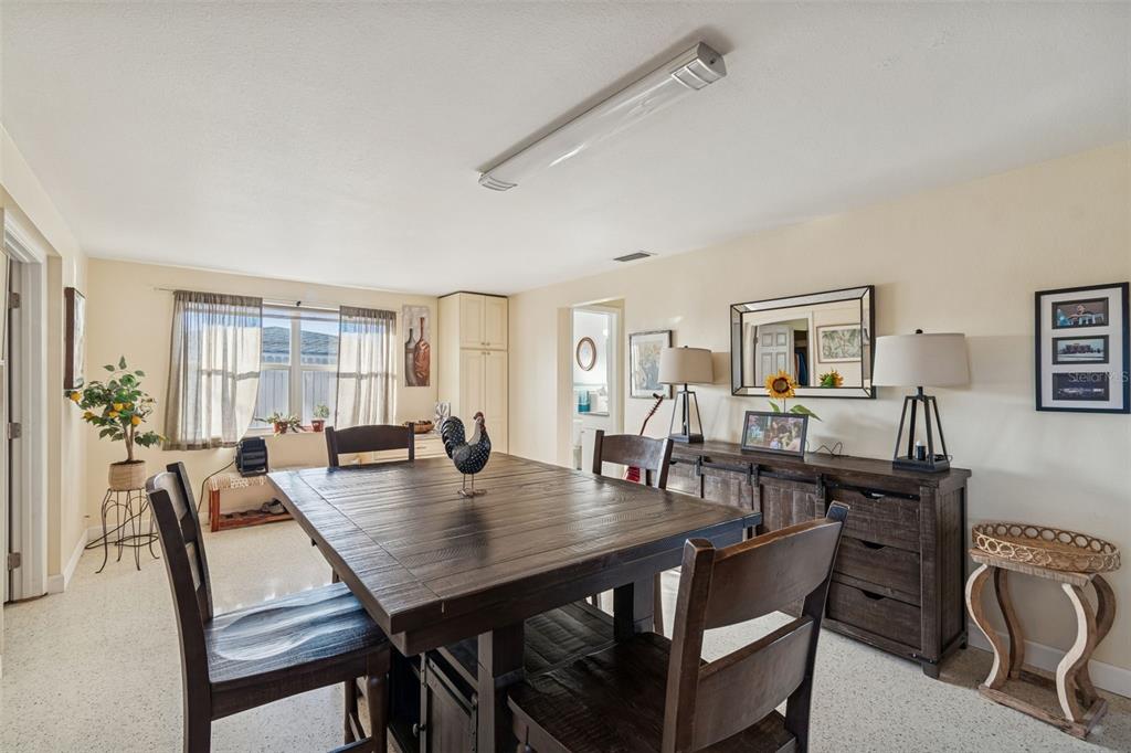 4940 Picture Avenue Holiday, FL 34690 - Photo 12 of 37 a view of a dining room with furniture
