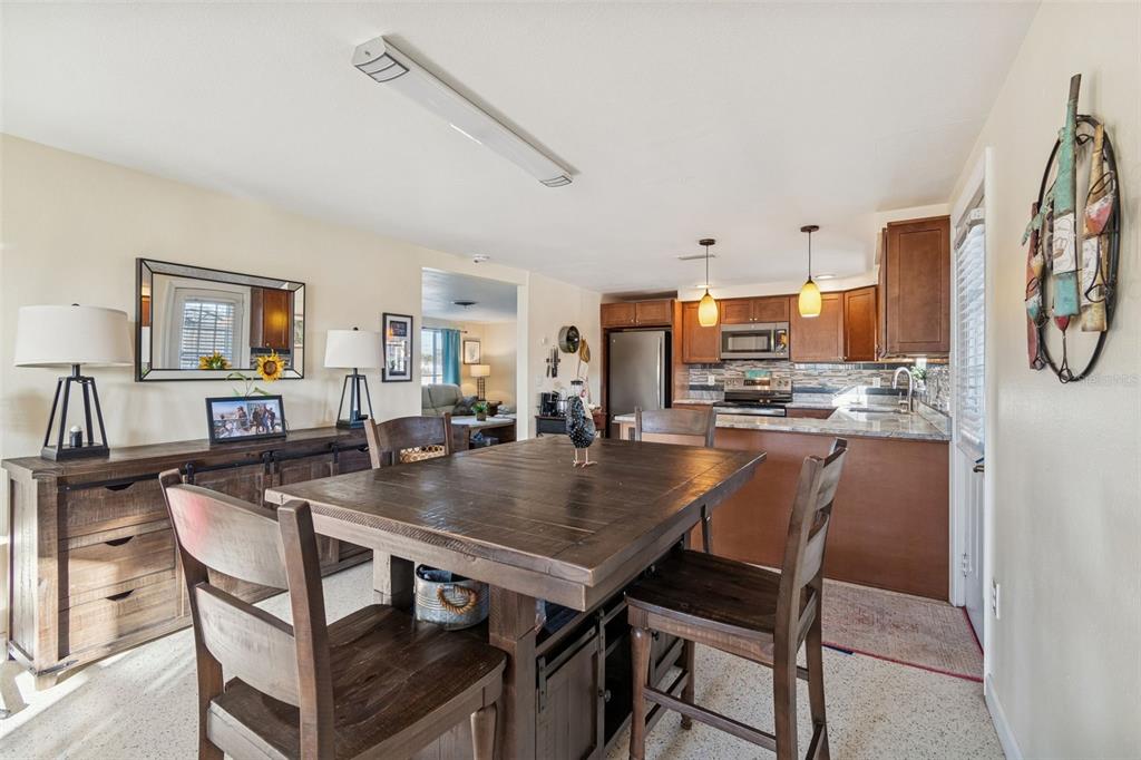 4940 Picture Avenue Holiday, FL 34690 - Photo 14 of 37 a view of a dining room with furniture
