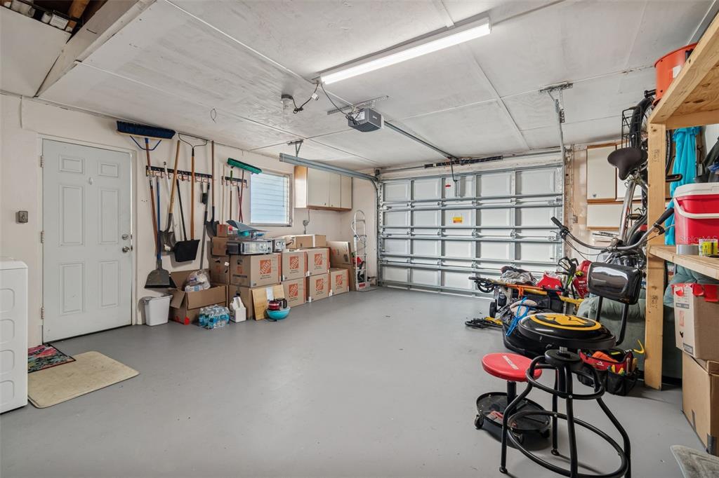 4940 Picture Avenue Holiday, FL 34690 - Photo 33 of 37 a bedroom with furniture and a chandelier