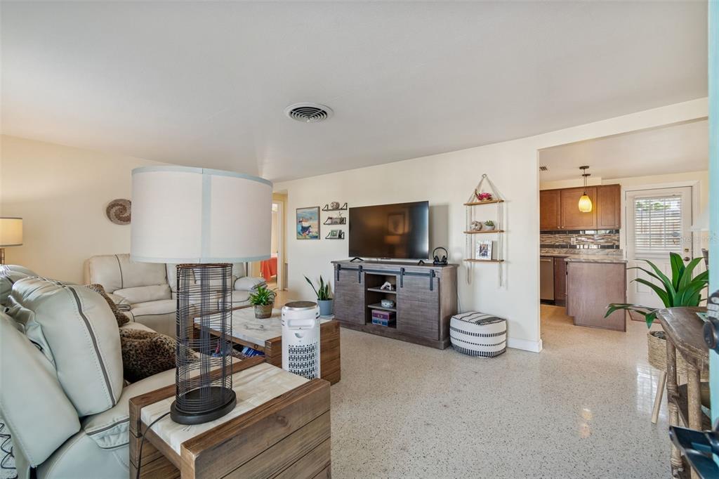 4940 Picture Avenue Holiday, FL 34690 - Photo 6 of 37 a living room with furniture and a flat screen tv