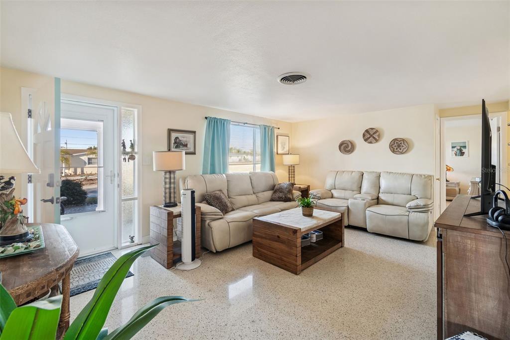 4940 Picture Avenue Holiday, FL 34690 - Photo 7 of 37 a living room with furniture and a large window