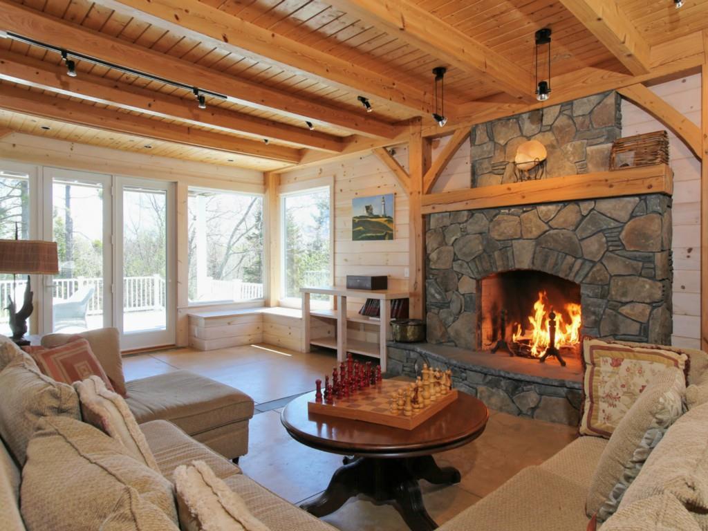 57 Coveside Road South Bristol, ME 04568 - Photo 2 of 33 Living room with wood burning fireplace.