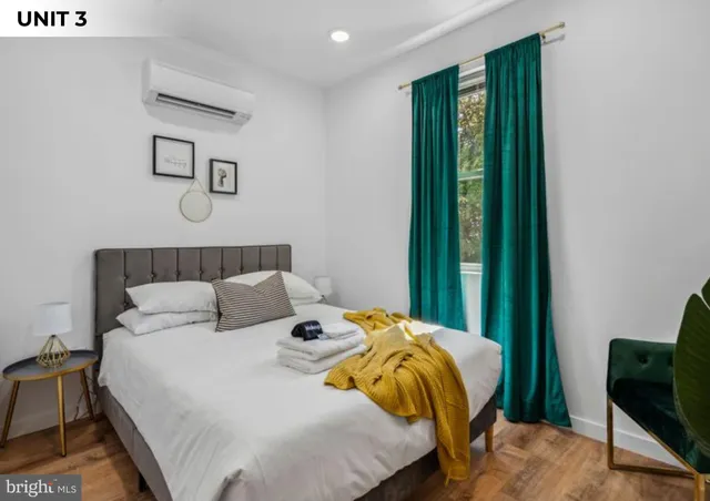 a bedroom with bed and a window