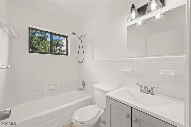 a bathroom with a sink a toilet and a bathtub