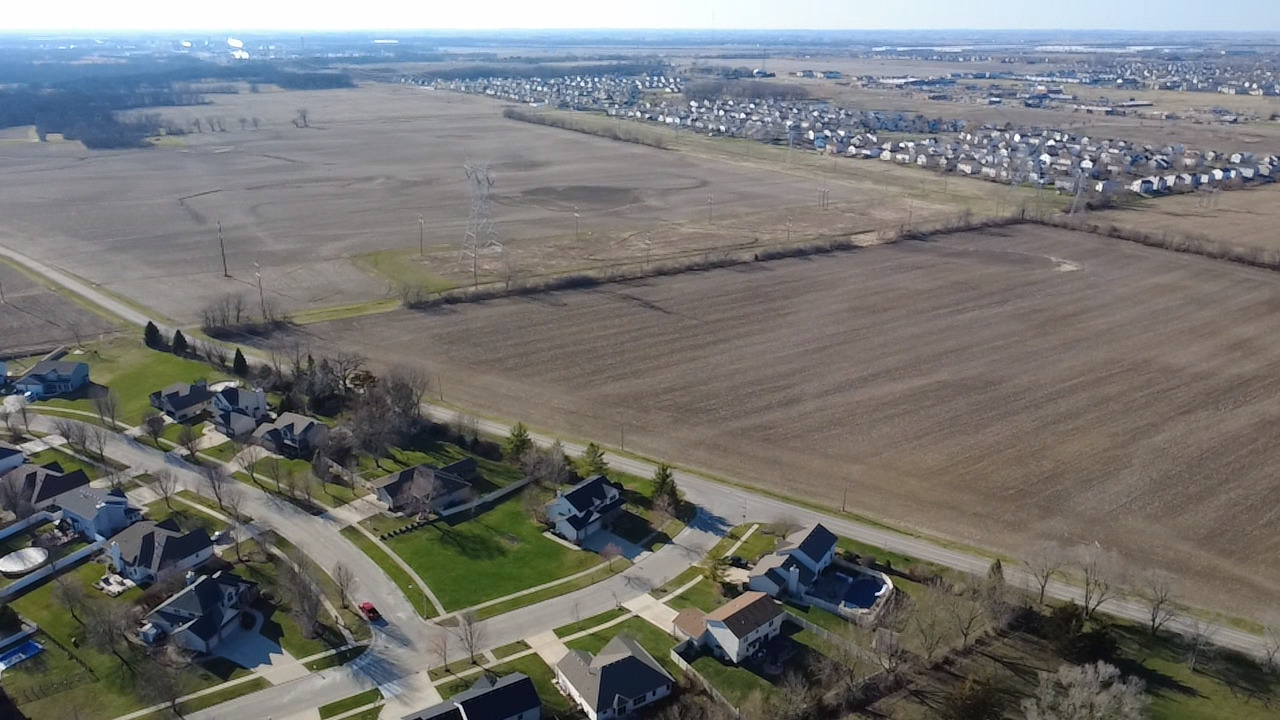 26124 Rachael Drive Channahon, IL 60410 - Photo 7 of 16 an aerial view of a house with a yard