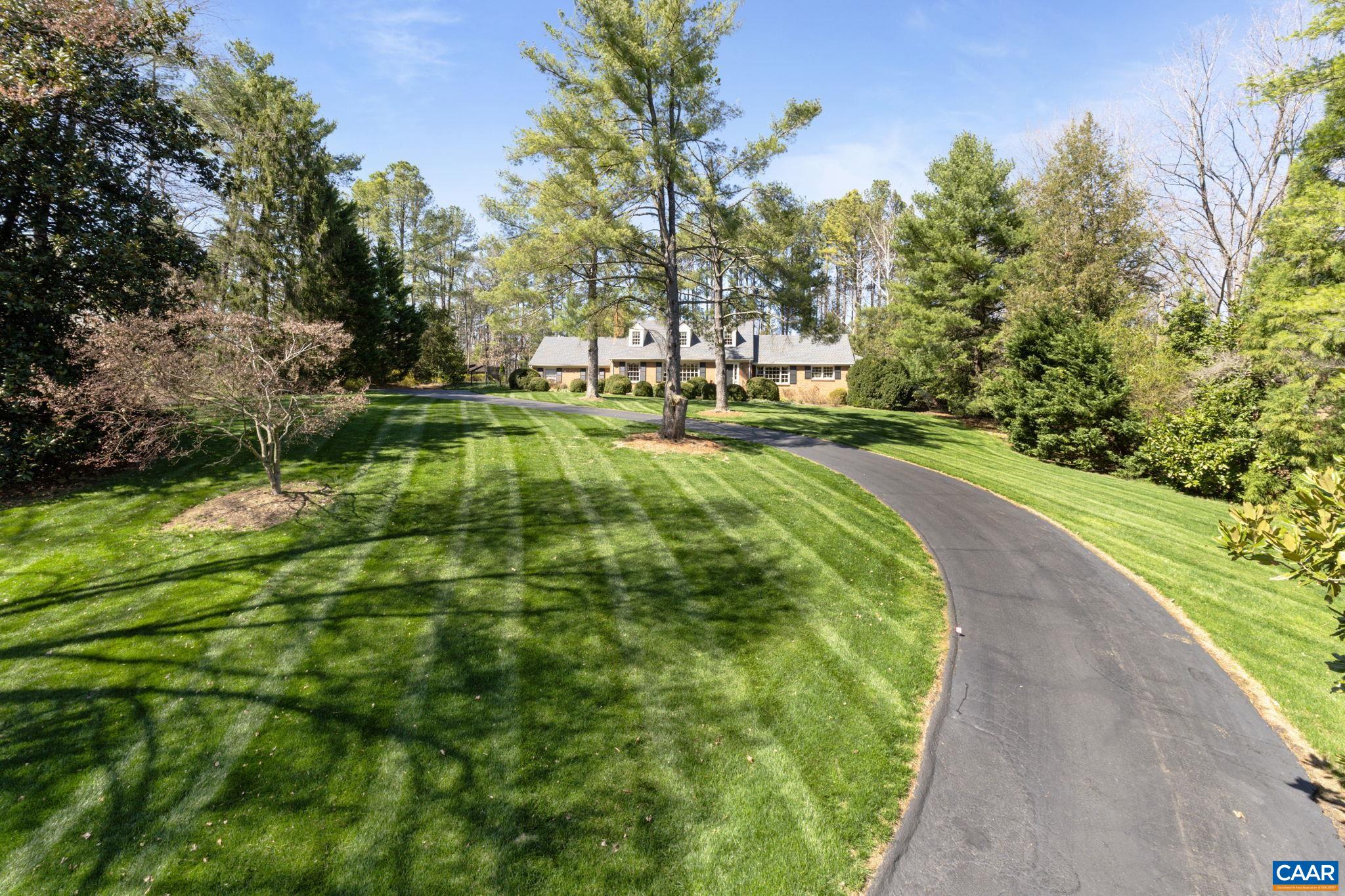 2507 Northfield Road Charlottesville, VA 22901 - Photo 1 of 68 a view of a swimming pool with a garden