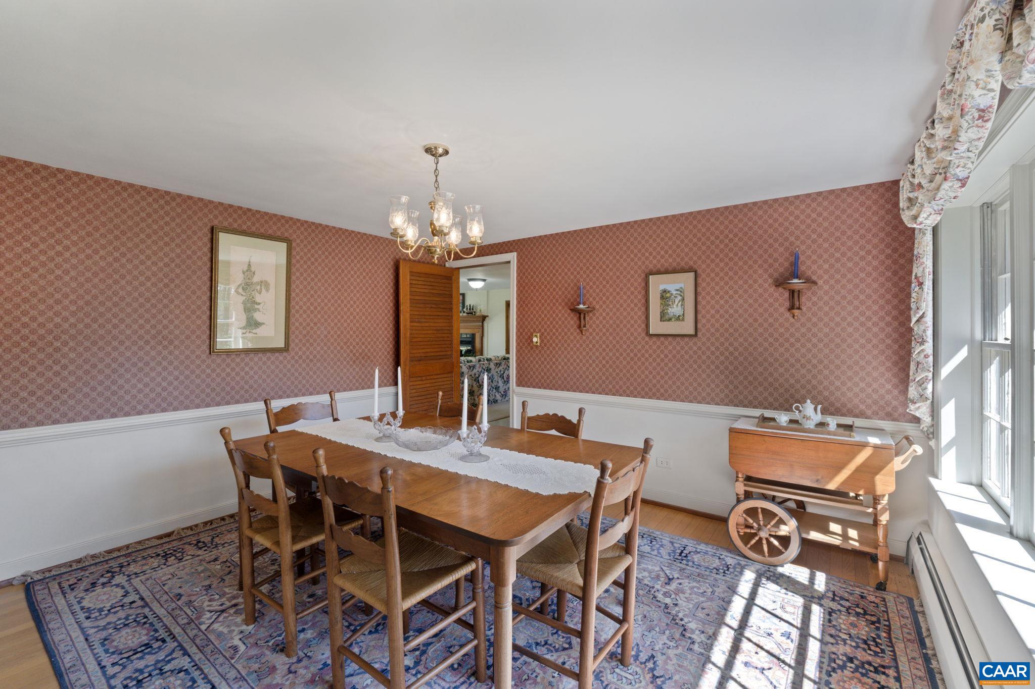 2507 Northfield Road Charlottesville, VA 22901 - Photo 12 of 68 a view of a dining room with furniture and chandelier