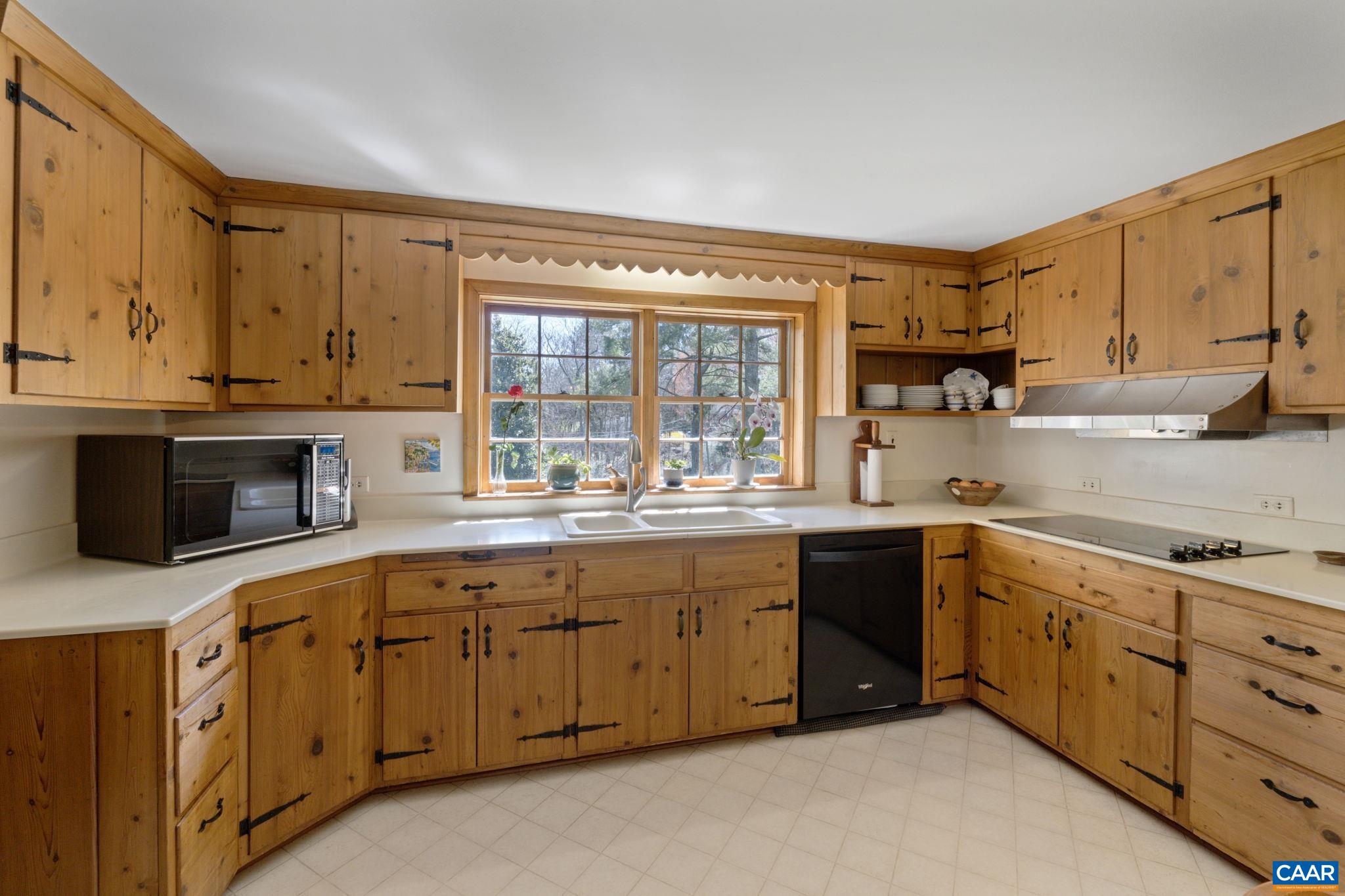 2507 Northfield Road Charlottesville, VA 22901 - Photo 15 of 68 a kitchen with sink cabinets and window