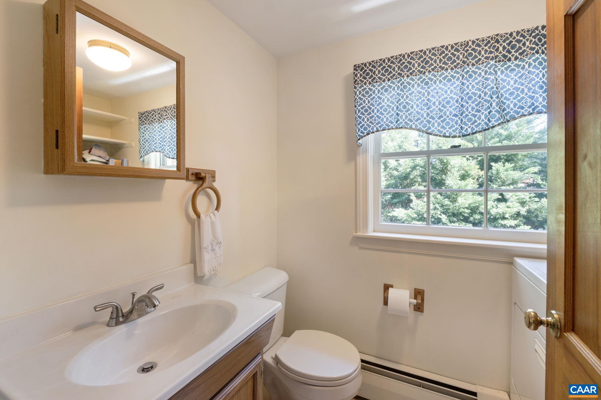 2507 Northfield Road Charlottesville, VA 22901 - Photo 17 of 68 a bathroom with a sink a mirror and a toilet