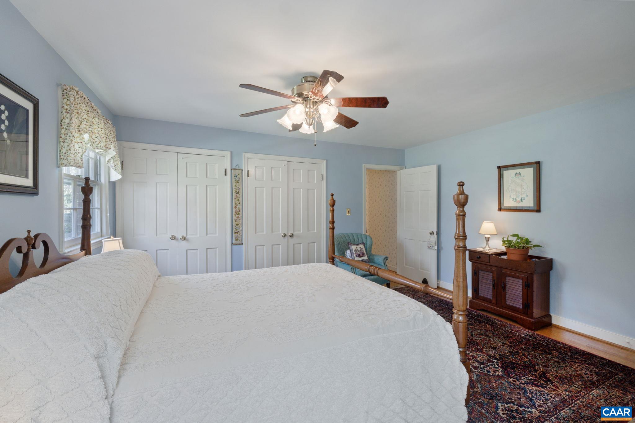 2507 Northfield Road Charlottesville, VA 22901 - Photo 27 of 68 a bedroom with a bed and a chandelier