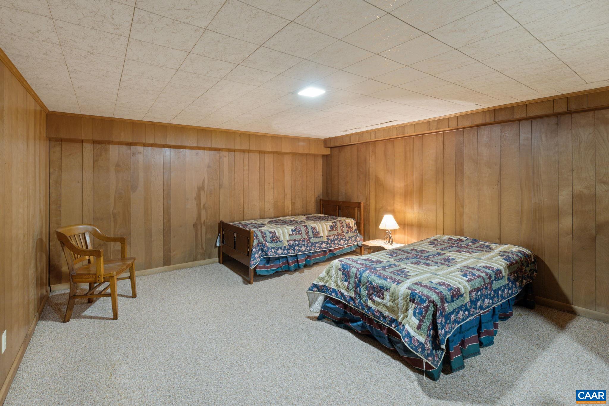 2507 Northfield Road Charlottesville, VA 22901 - Photo 45 of 68 a bedroom with 2 bed table and a chair