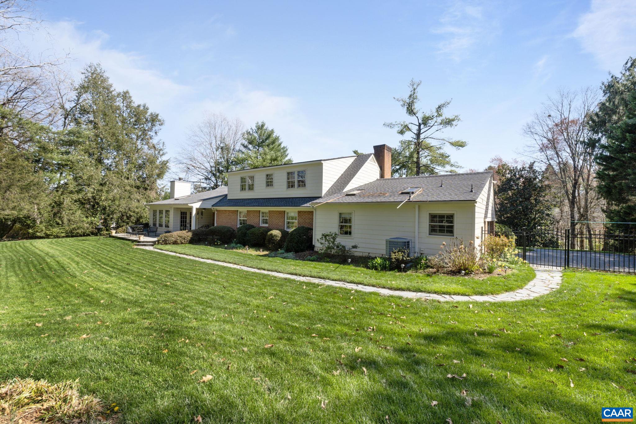 2507 Northfield Road Charlottesville, VA 22901 - Photo 48 of 68 a front view of house with a garden and trees
