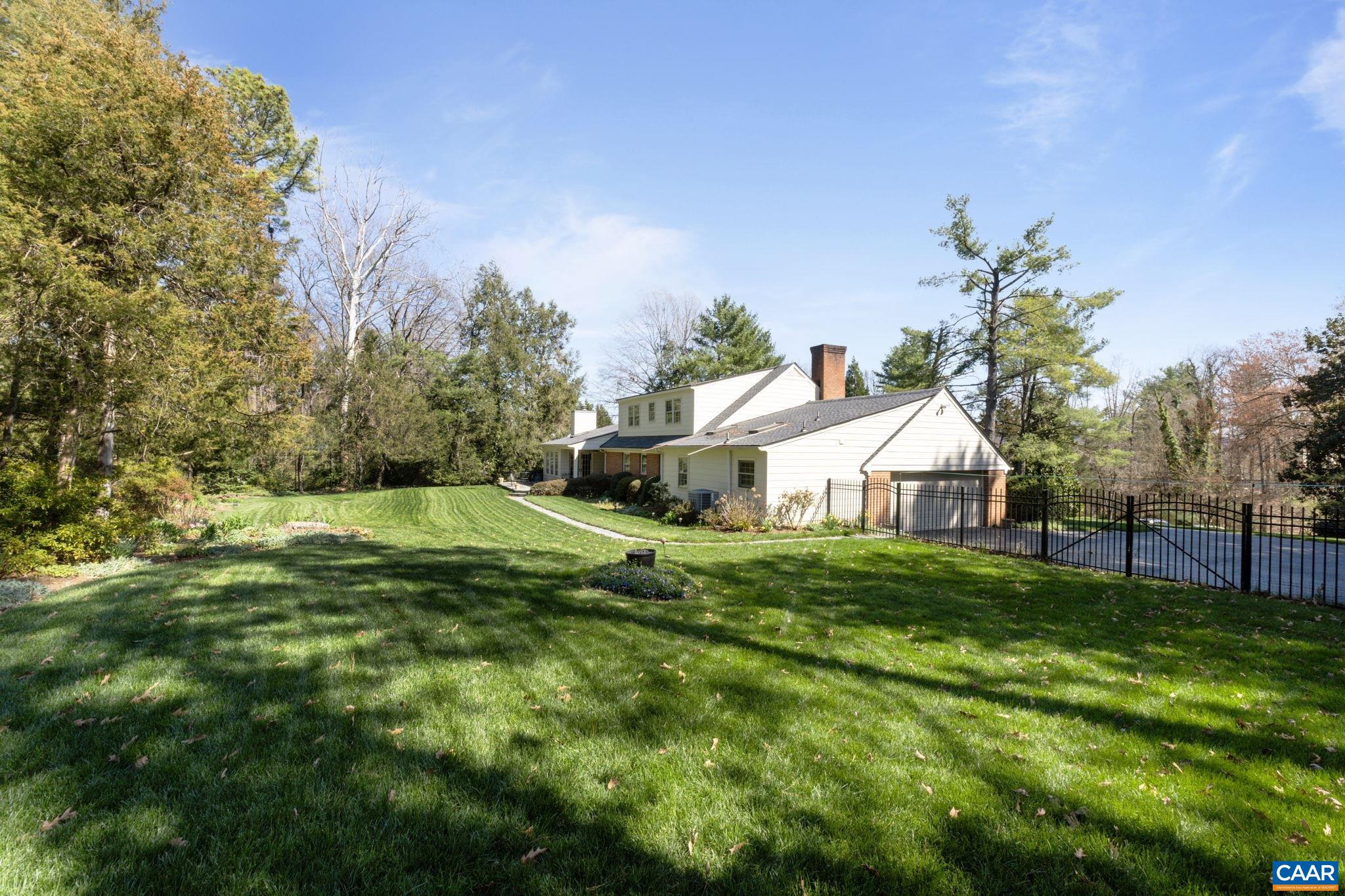 2507 Northfield Road Charlottesville, VA 22901 - Photo 51 of 68 a front view of a house with a yard and trees