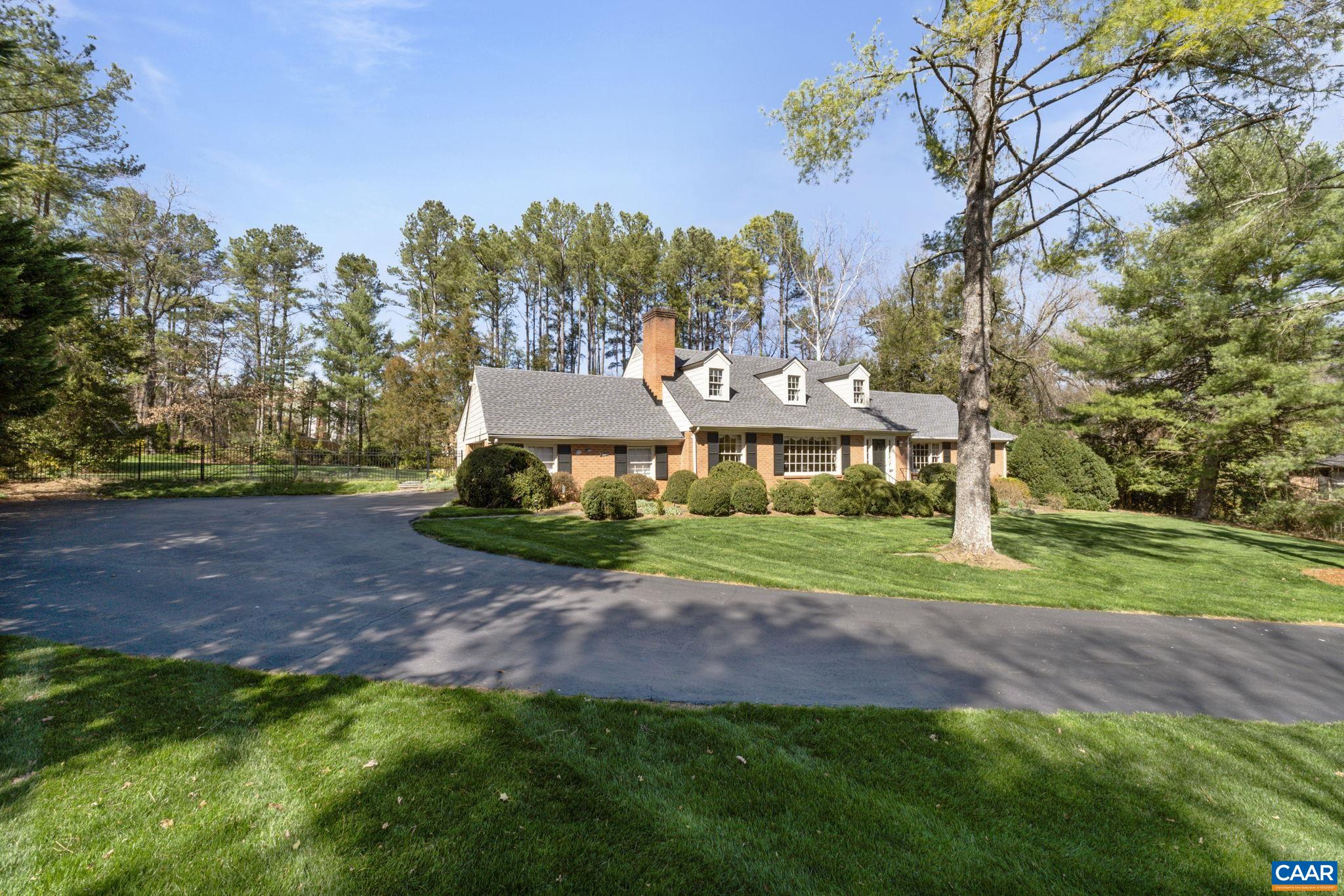 2507 Northfield Road Charlottesville, VA 22901 - Photo 65 of 68 a view of a big house with a big yard and large trees