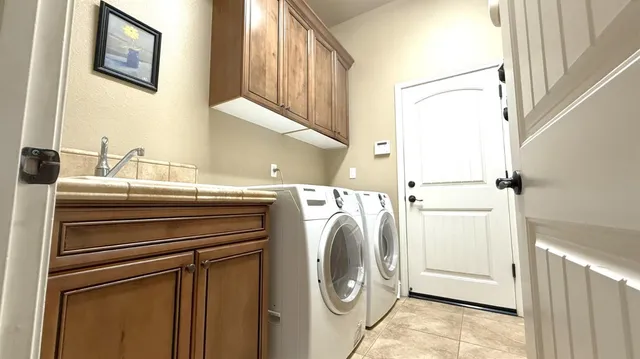 a utility room with dryer and washer