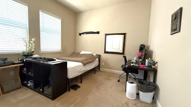 a building outdoor space with patio furniture and potted plants