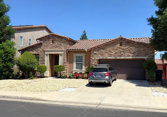 a car parked in front of a house