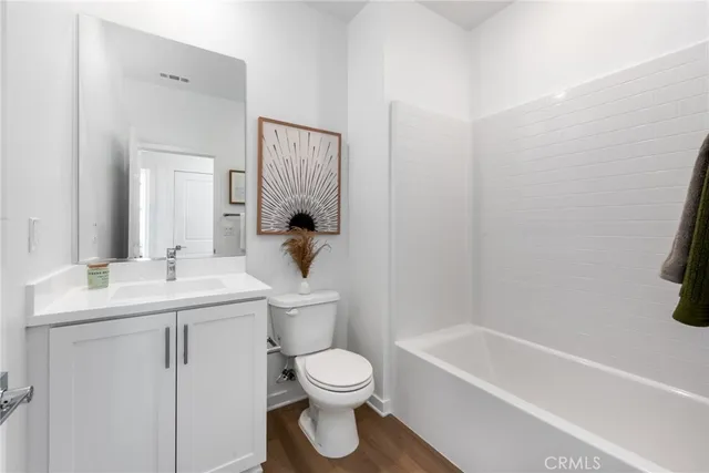 a bathroom with a toilet sink and bathtub