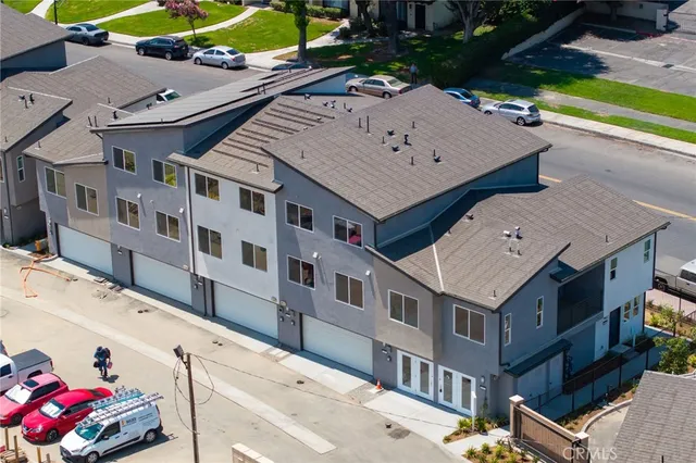 an aerial view of a house with a swimming pool
