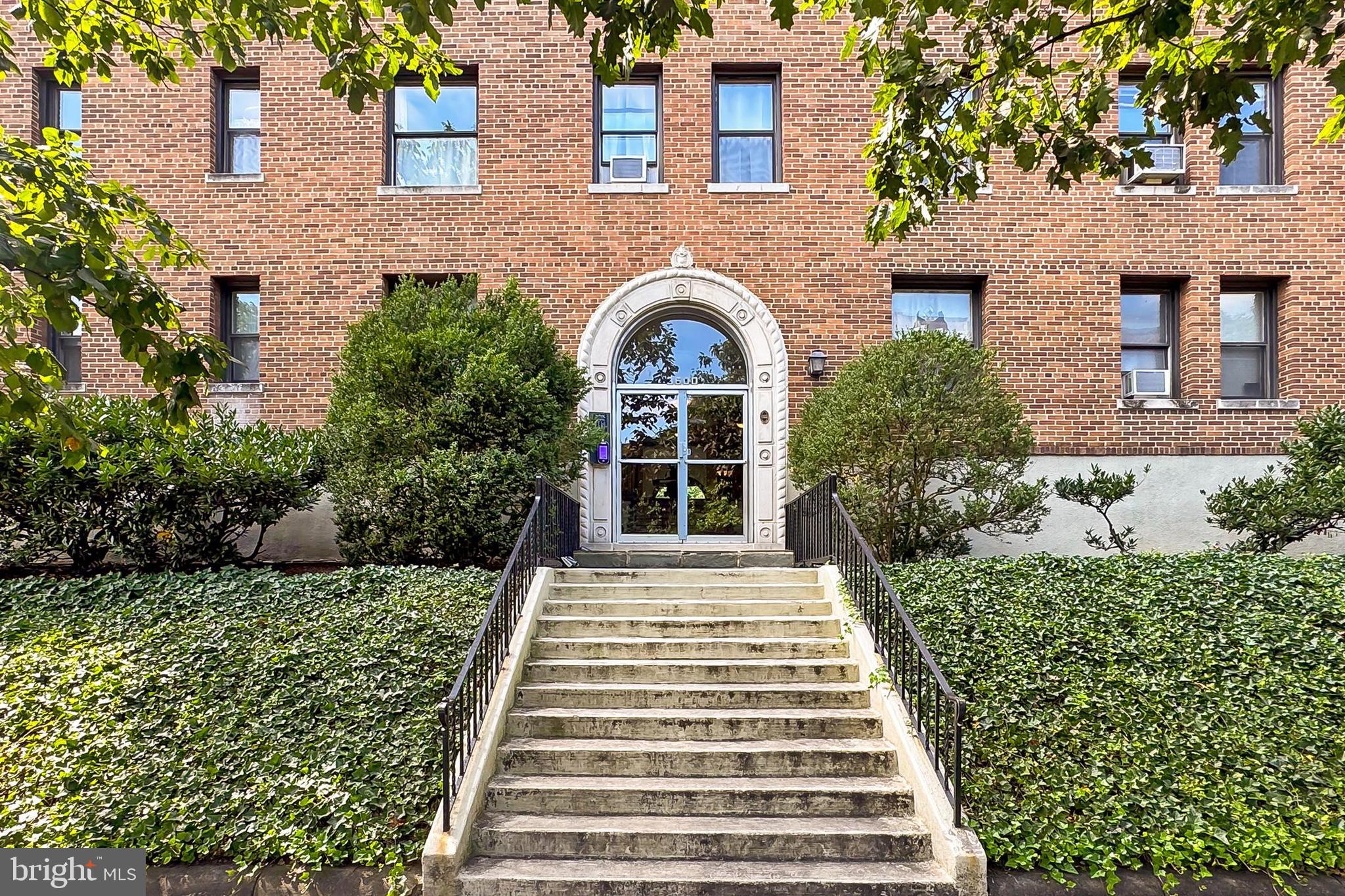 front view of a house with a garden