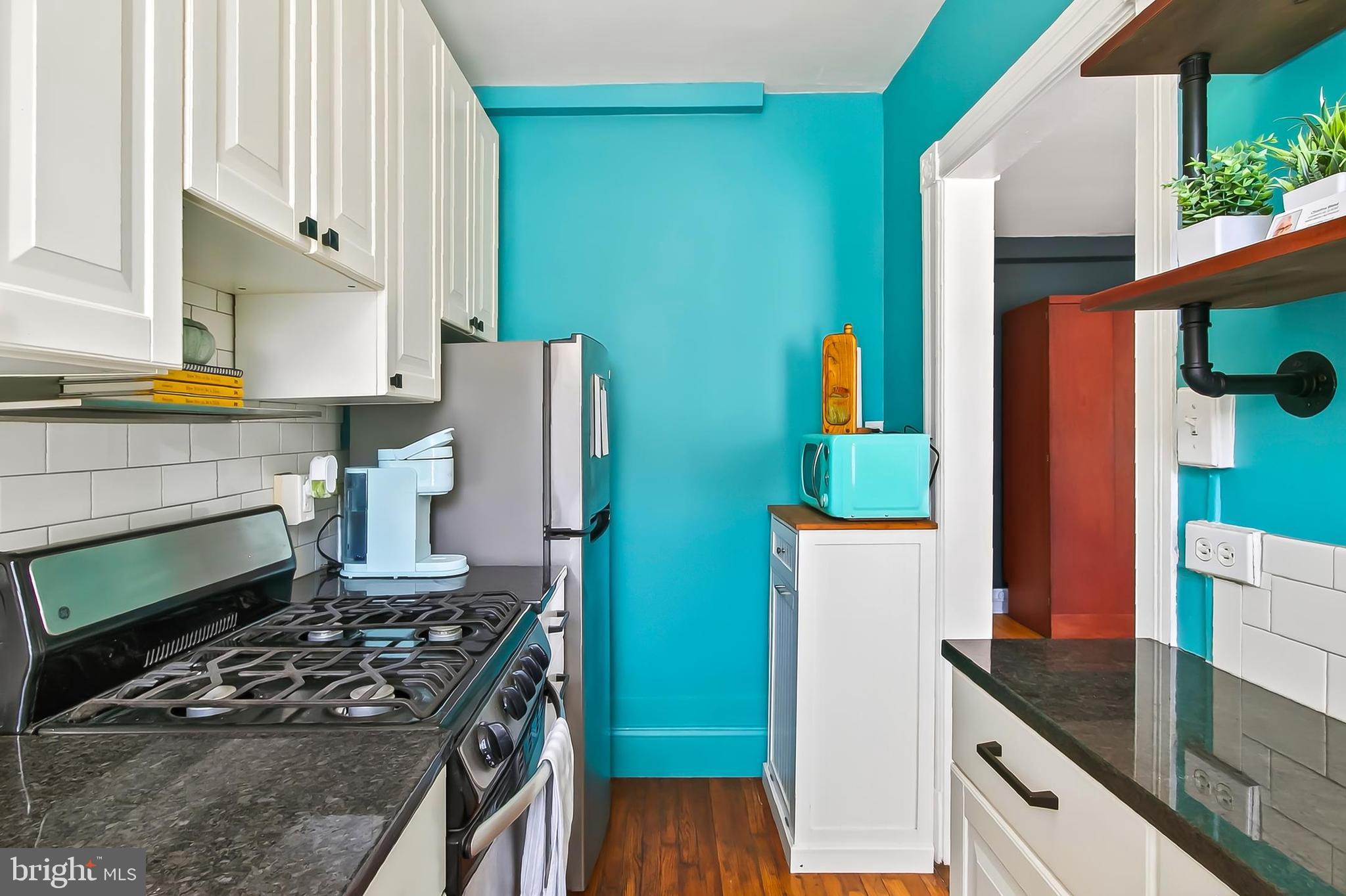 3600 Connecticut Avenue Northwest, Unit 105 Washington, DC 20008 - Photo 21 of 55 a kitchen with stainless steel appliances granite countertop a stove and a refrigerator
