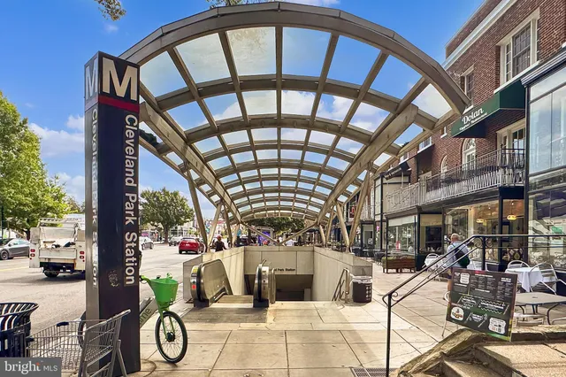 a view of path along with retail shop and buildings