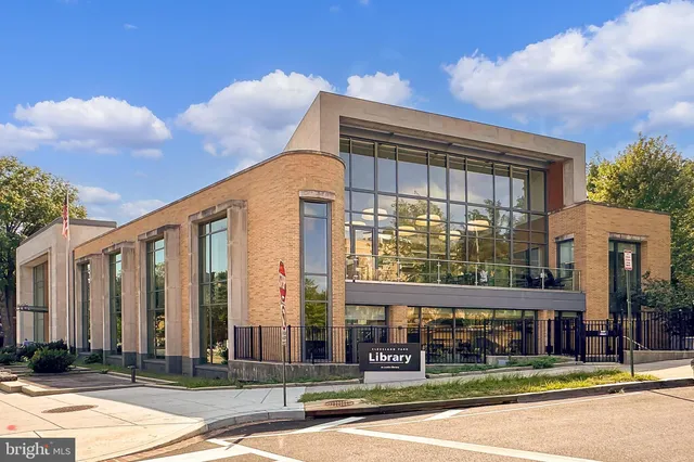 a swimming pool with trees in the background