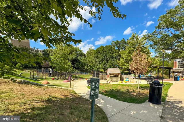 a front view of a residential apartment building with a yard
