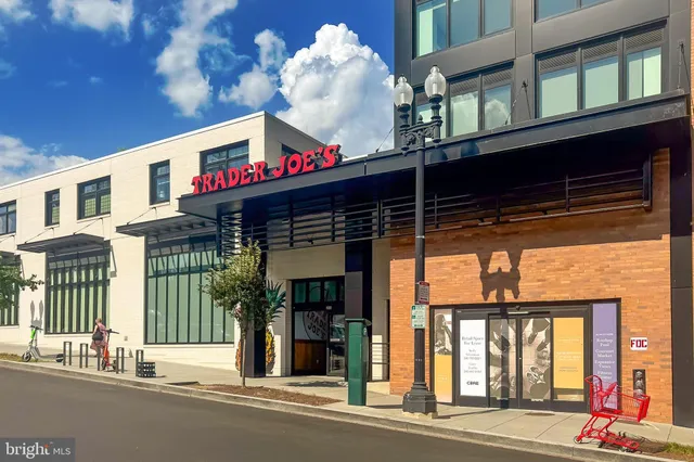 a view of a tennis ground with a bench in the patio