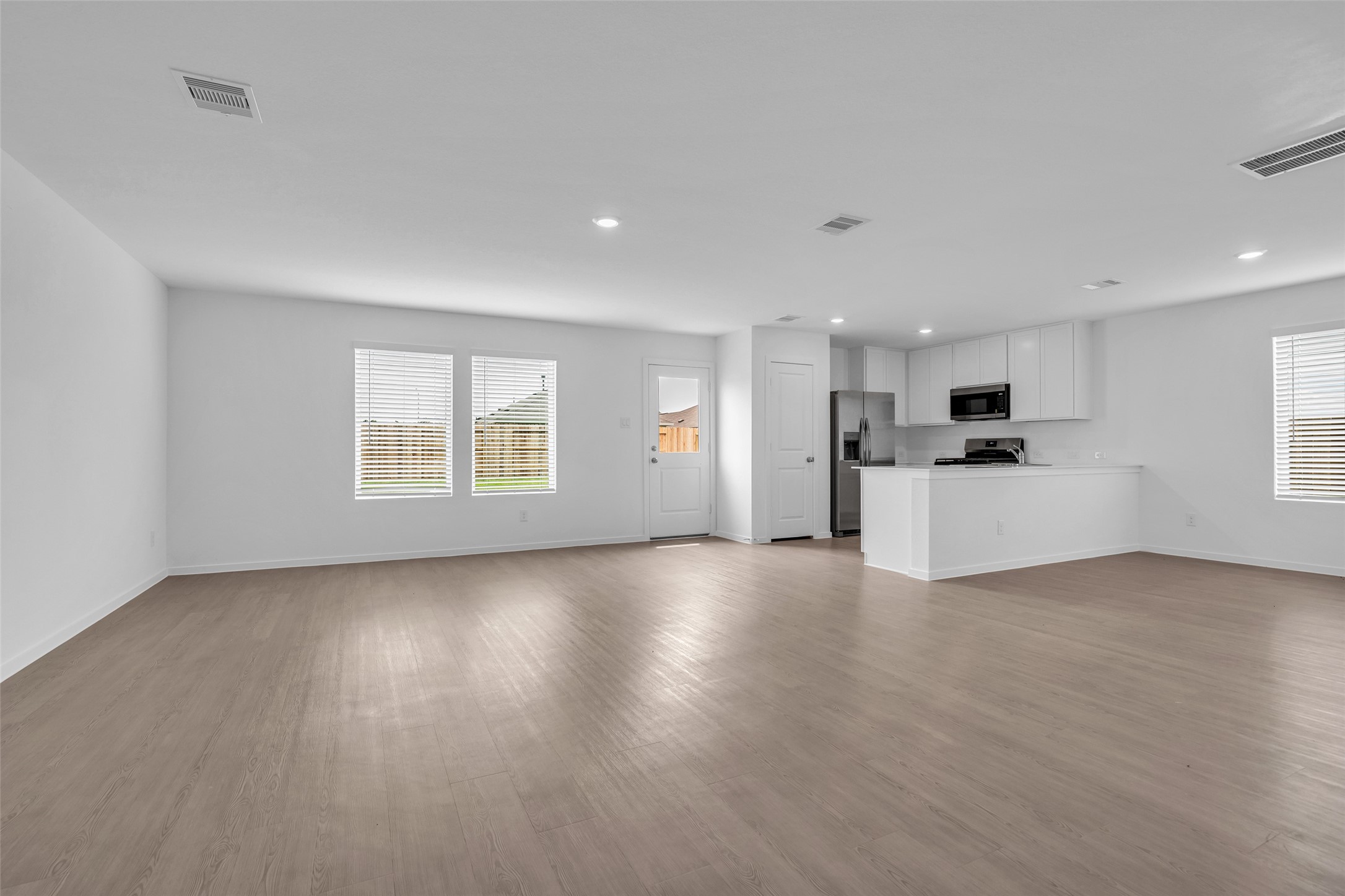 254 Farray Forest Magnolia, TX 77354 - Photo 2 of 16 Open-concept kitchen and living area, perfect for entertaining and everyday living. This spacious layout features modern finishes, abundant natural light, and seamless flow throughout the main floor.