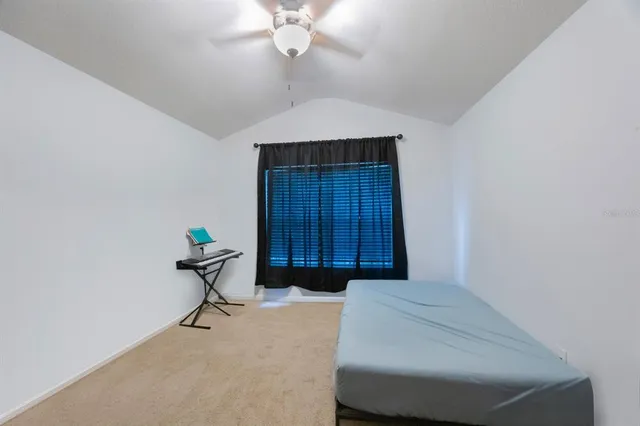 a bedroom with a bed and cabinets