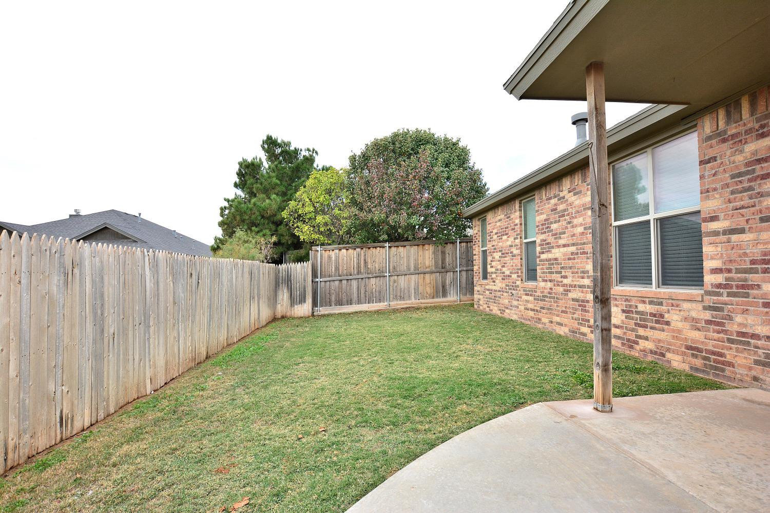 2623 112th Street Lubbock, TX 79423 - Photo 16 of 16 a view of a back yard of the house