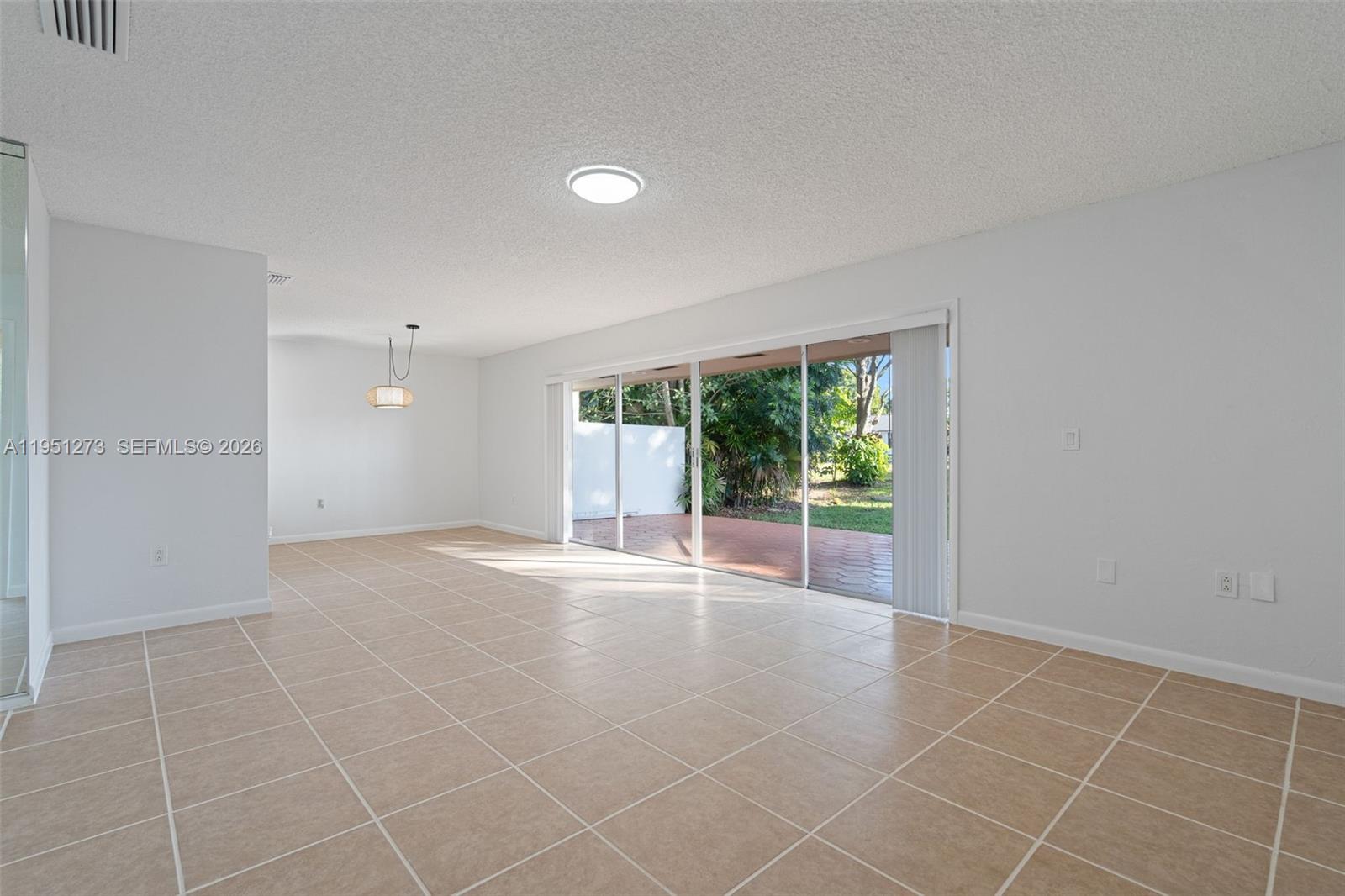 8134 Southwest 83rd Street Miami, FL 33143 - Photo 2 of 15 a view of an empty room with glass door