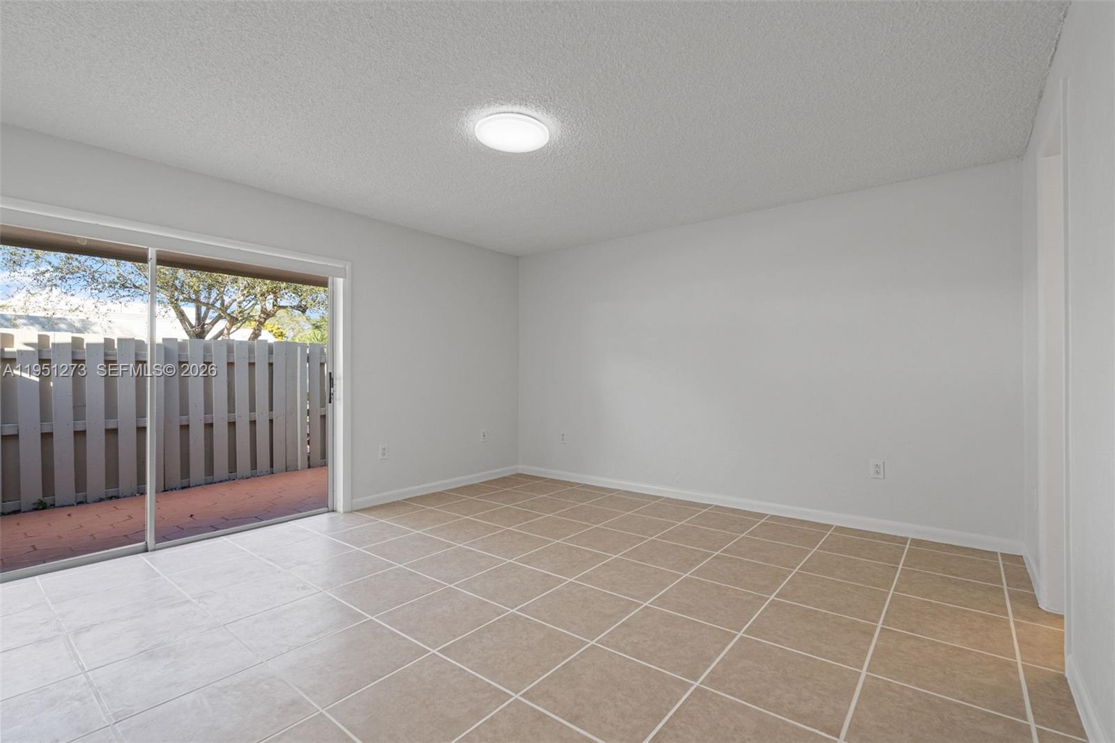 8134 Southwest 83rd Street Miami, FL 33143 - Photo 6 of 15 a view of an empty room with a window