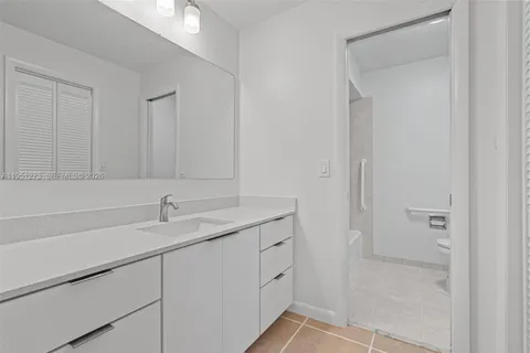 a bathroom with a sink and vanity