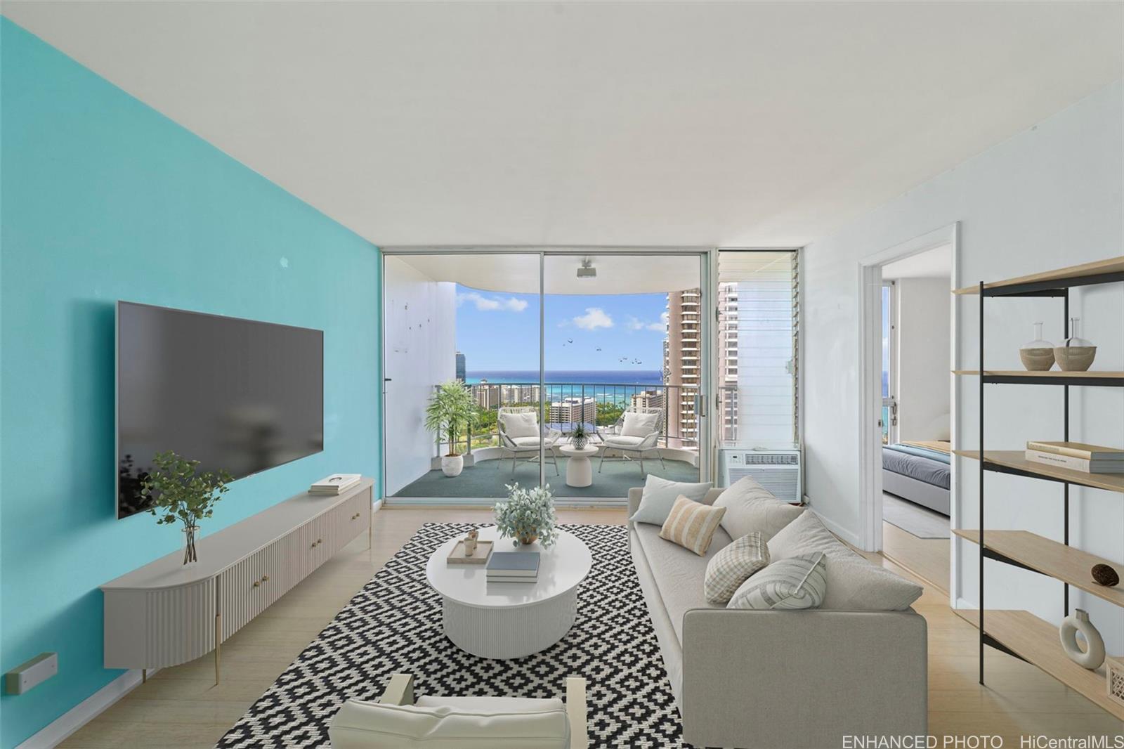 469 Ena Road, Unit 3208 Honolulu, HI 96815 - Photo 1 of 1 a living room with furniture and a flat screen tv