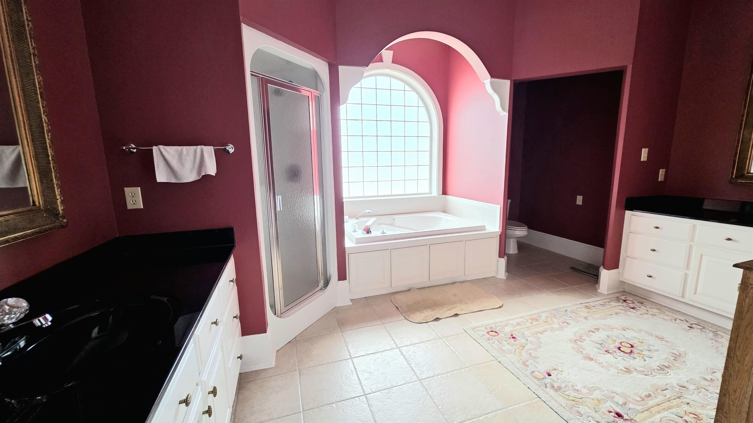 3070 Caney Branch Road Adamsville, TN 38310 - Photo 13 of 24 a bathroom with a bathtub sink and mirror