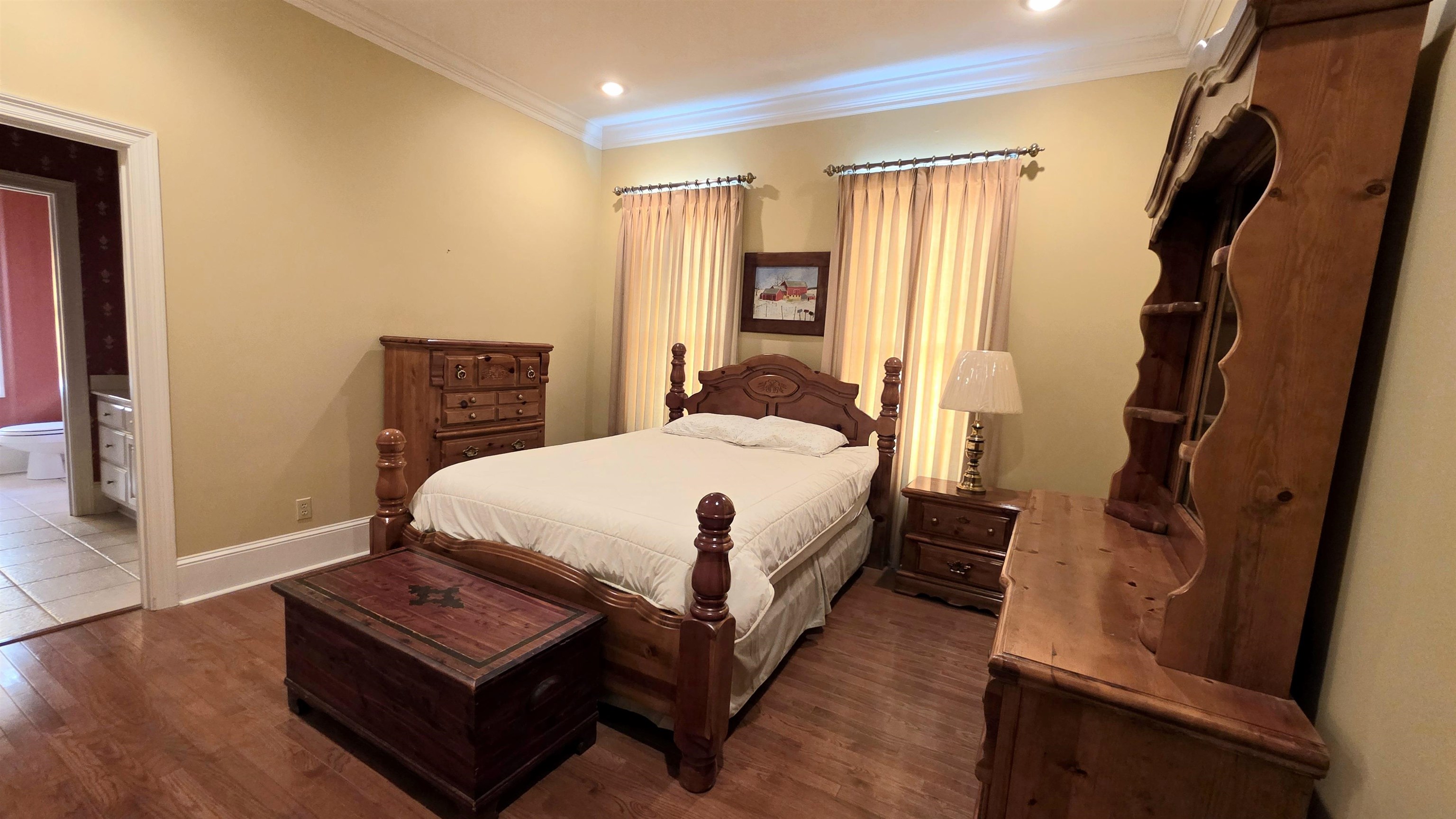 3070 Caney Branch Road Adamsville, TN 38310 - Photo 16 of 24 a bed room with a bed and a window