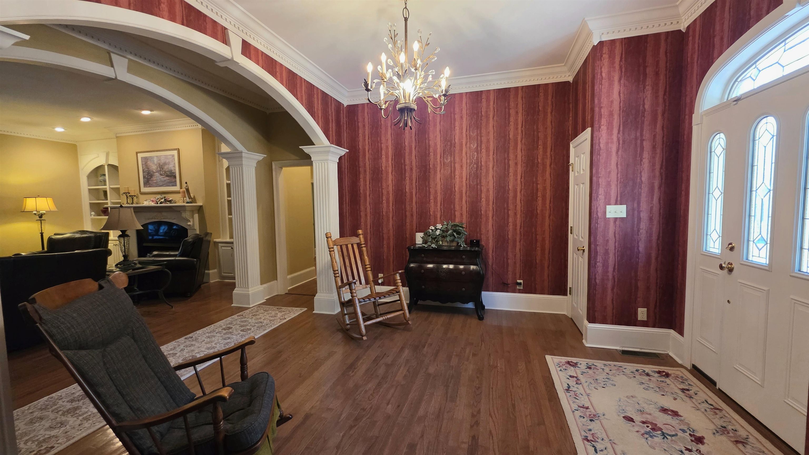 3070 Caney Branch Road Adamsville, TN 38310 - Photo 2 of 24 a living room with furniture and a chandelier