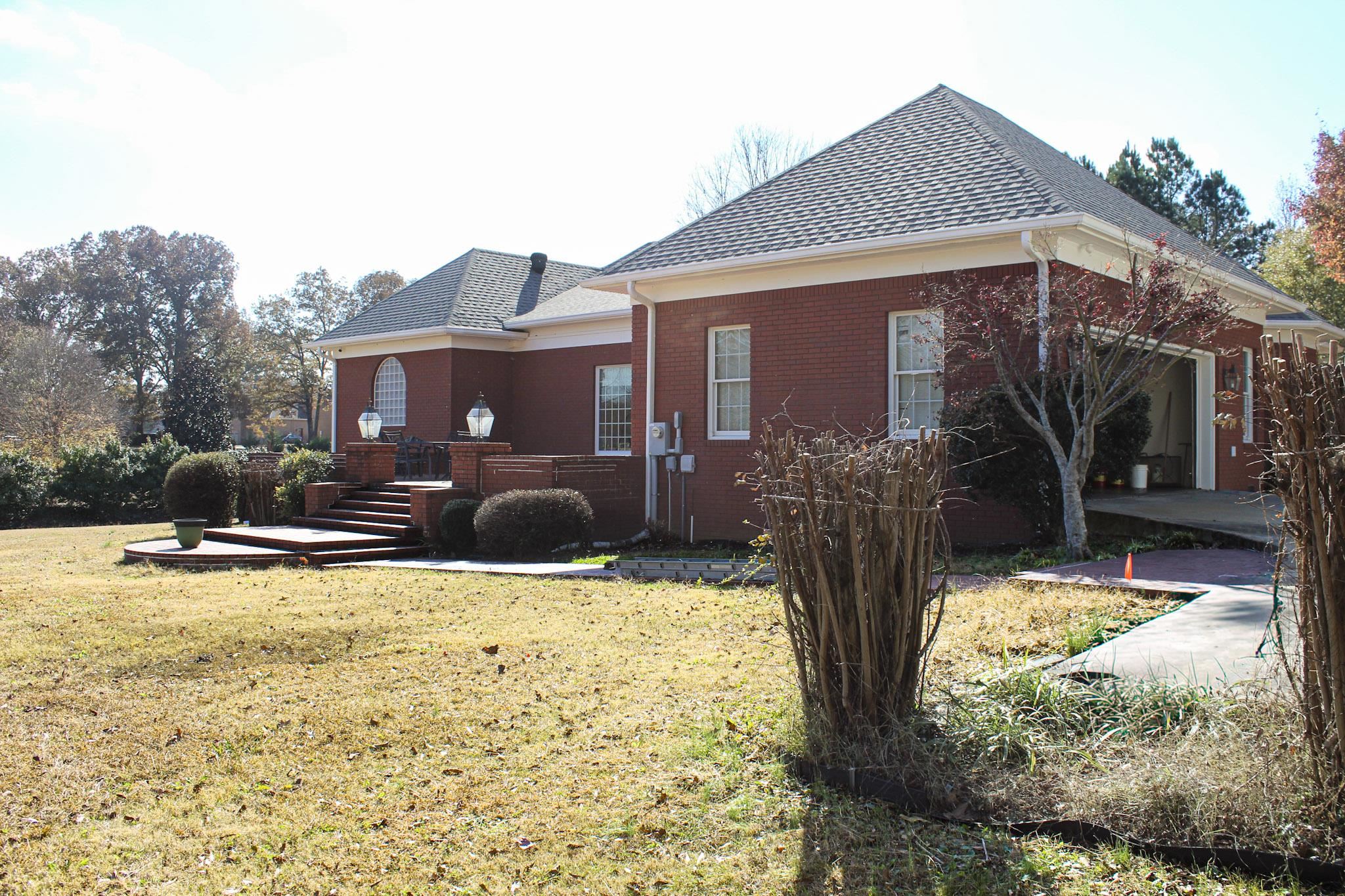 3070 Caney Branch Road Adamsville, TN 38310 - Photo 21 of 24 a view of a house with backyard outdoor space and sitting area